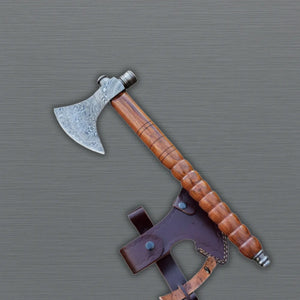 Viking tomahawk axe with pipe bowl close-up