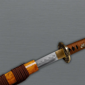 Sword with a brown handle and gold guard on a gray background