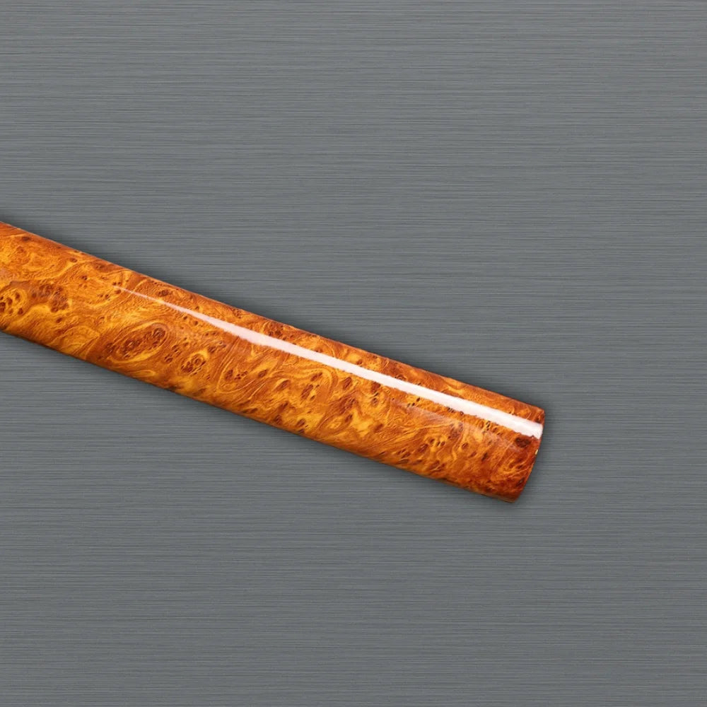 Artisan-crafted clay-tempered katana on display handle