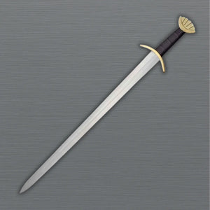 Sword with a decorative hilt on a gray background
